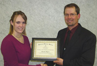 Amanda-Bryson-accepts-the-first-Dr-James-C-Schmulbach-Memorial-Scholarship-from-President-Jason-Lee