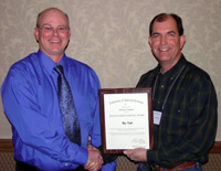 Dakota-Chapter-President-Todd-St-Sauver-left-bestows-the-Distinguished-Professional-Service-Award-to-Ron-Koth