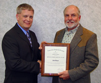 Emil-Berard-left-receives-the-Distinguished-Professional-Service-Award-from-Scott-Elstad