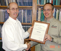 Jack-Erickson-left-receives-the-Distinguished-Professional-Service-Award-from-Dennis-Unkenholz