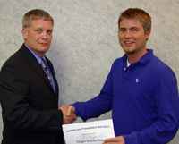 Mark-Kaemingk-right-receives-the-Kriel-Award-and-a-Sauger-Scholarship-from-Dakota-Chapter-President-Scott-Elstad