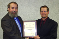 Richard-Madsen-left-receives-the-Distinguished-Professional-Service-Award-from-President-Jason-Lee