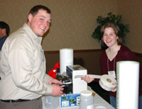 South-Dakota-State-University-students-Mark-Fincel-left-and-Bethany-Galster-gleefully-transact-business-during-the-student-raffle